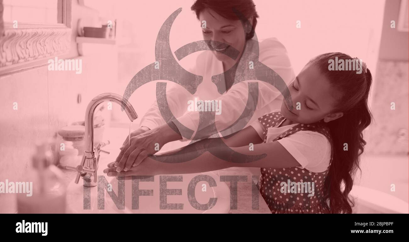 Digital illustration of a hazard sign with a sign Infection over a woman and her daughter washing ha Stock Photo