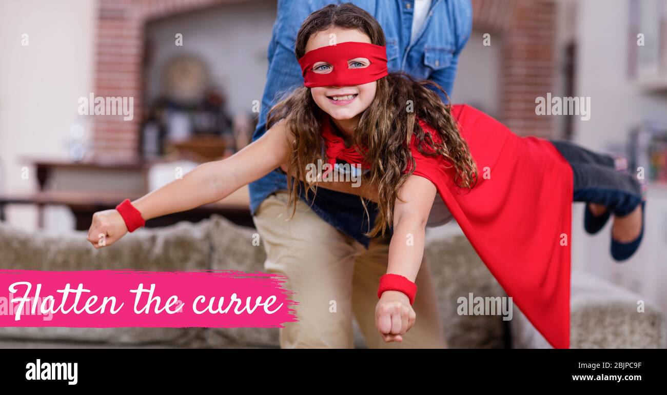 The words Flatten the curve with a Caucasian man and girl wearing capes during coronavirus covid19 p Stock Photo