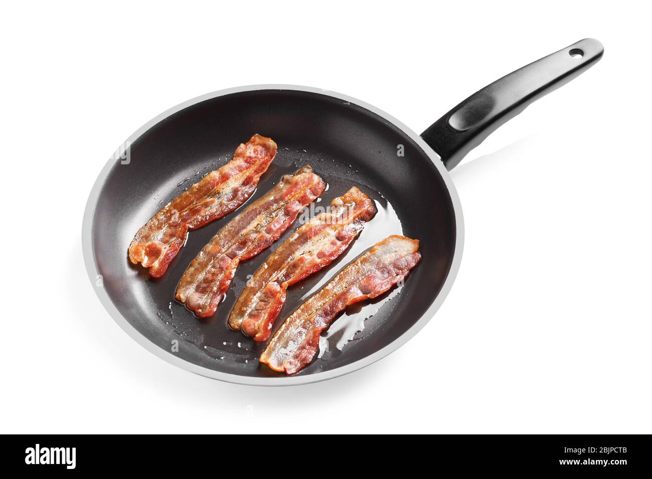 Frying pan with cooked bacon rashers on white background Stock Photo - Alamy