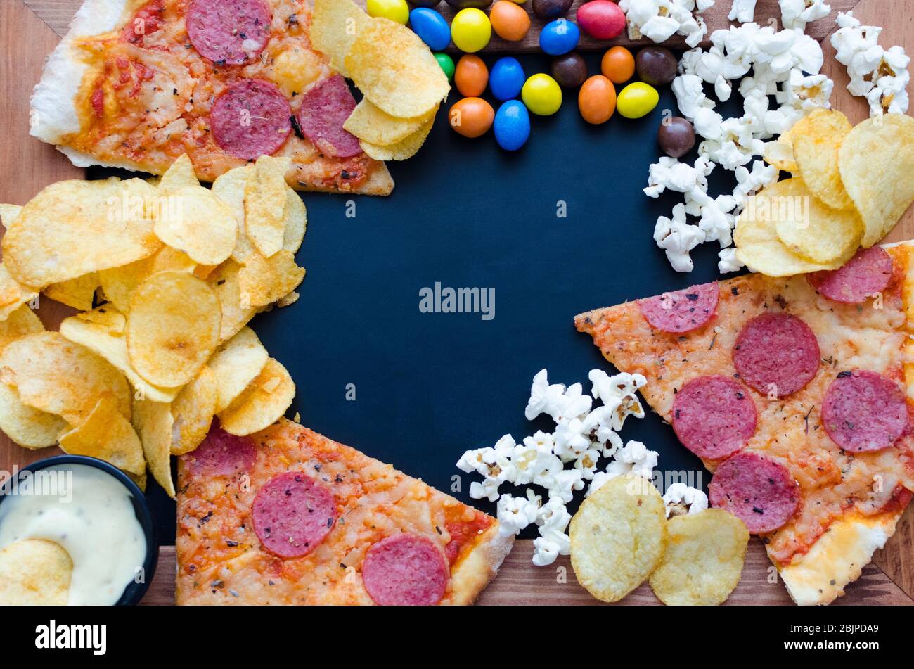 Fast food and unhealthy eating concept. Close up of fastfood snacks