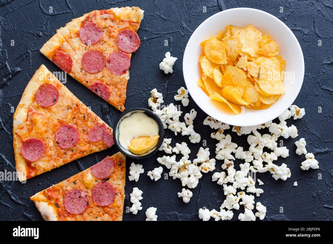 Fast food and unhealthy eating concept. Close up of fastfood snacks