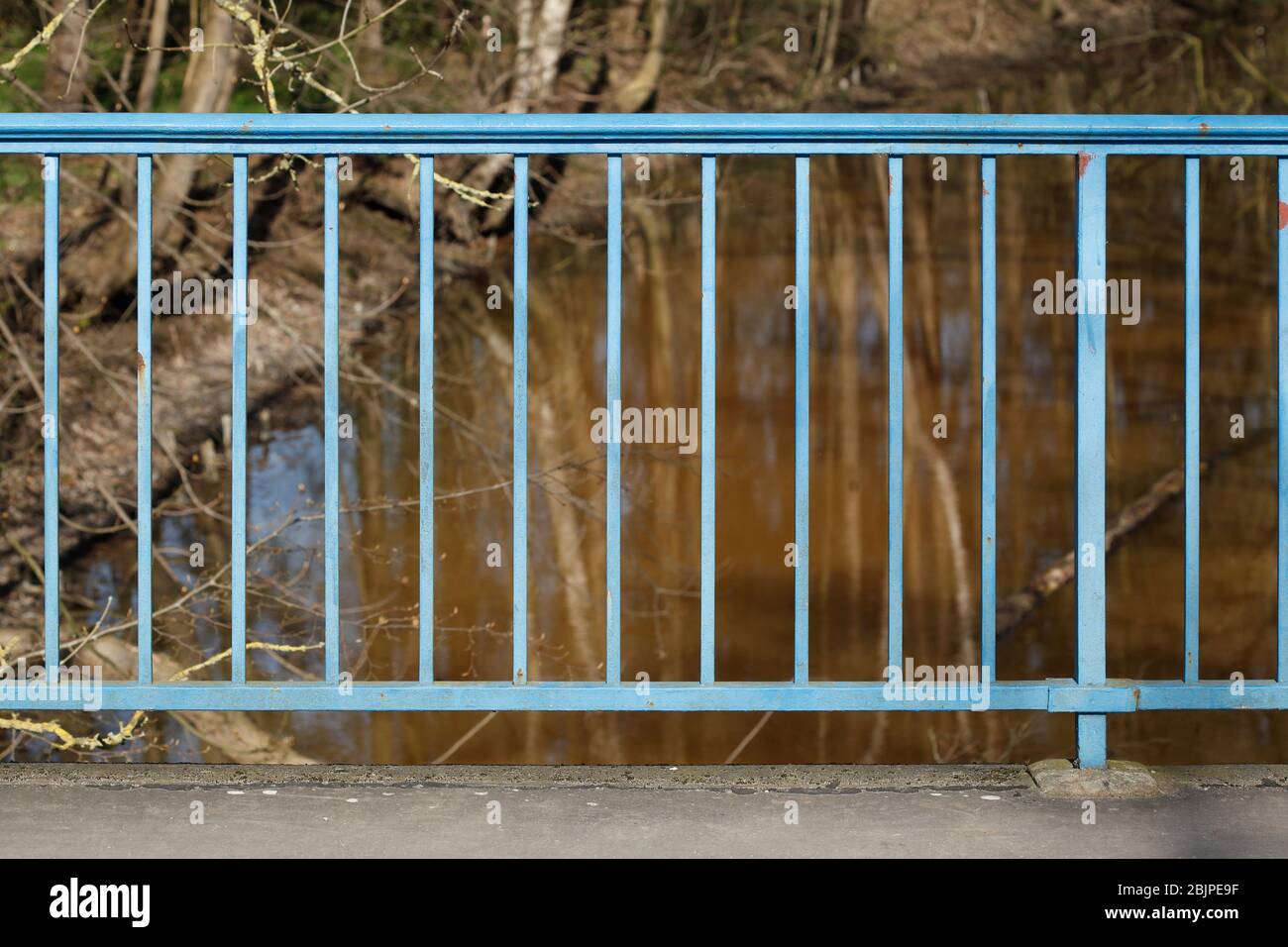 Blue bridge railing on a body of water, Germany, Europe Stock Photo - Alamy