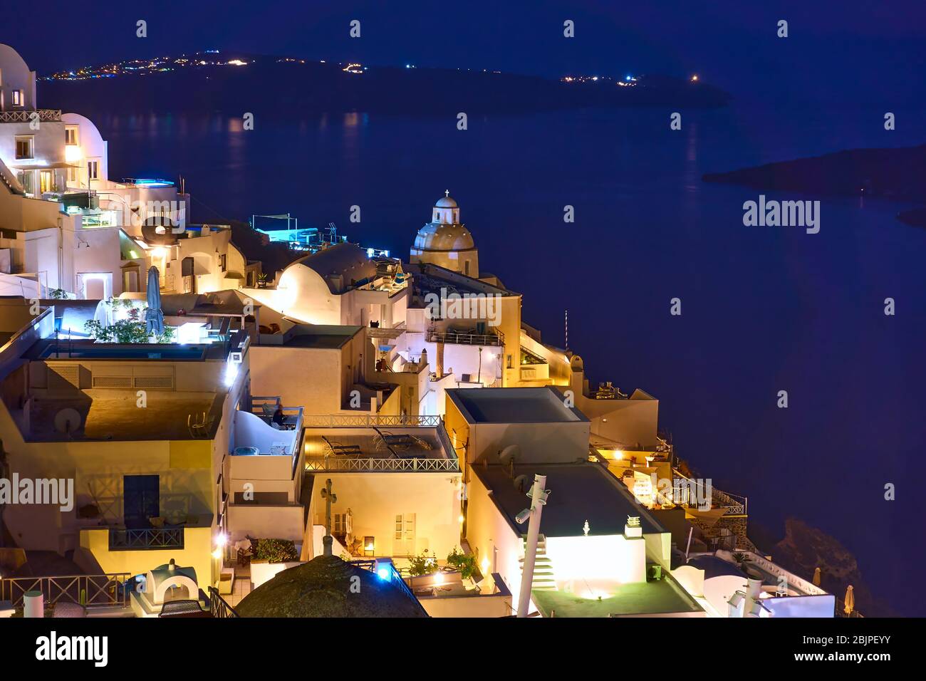 Thira town in Santorini Island at night, Greece Stock Photo
