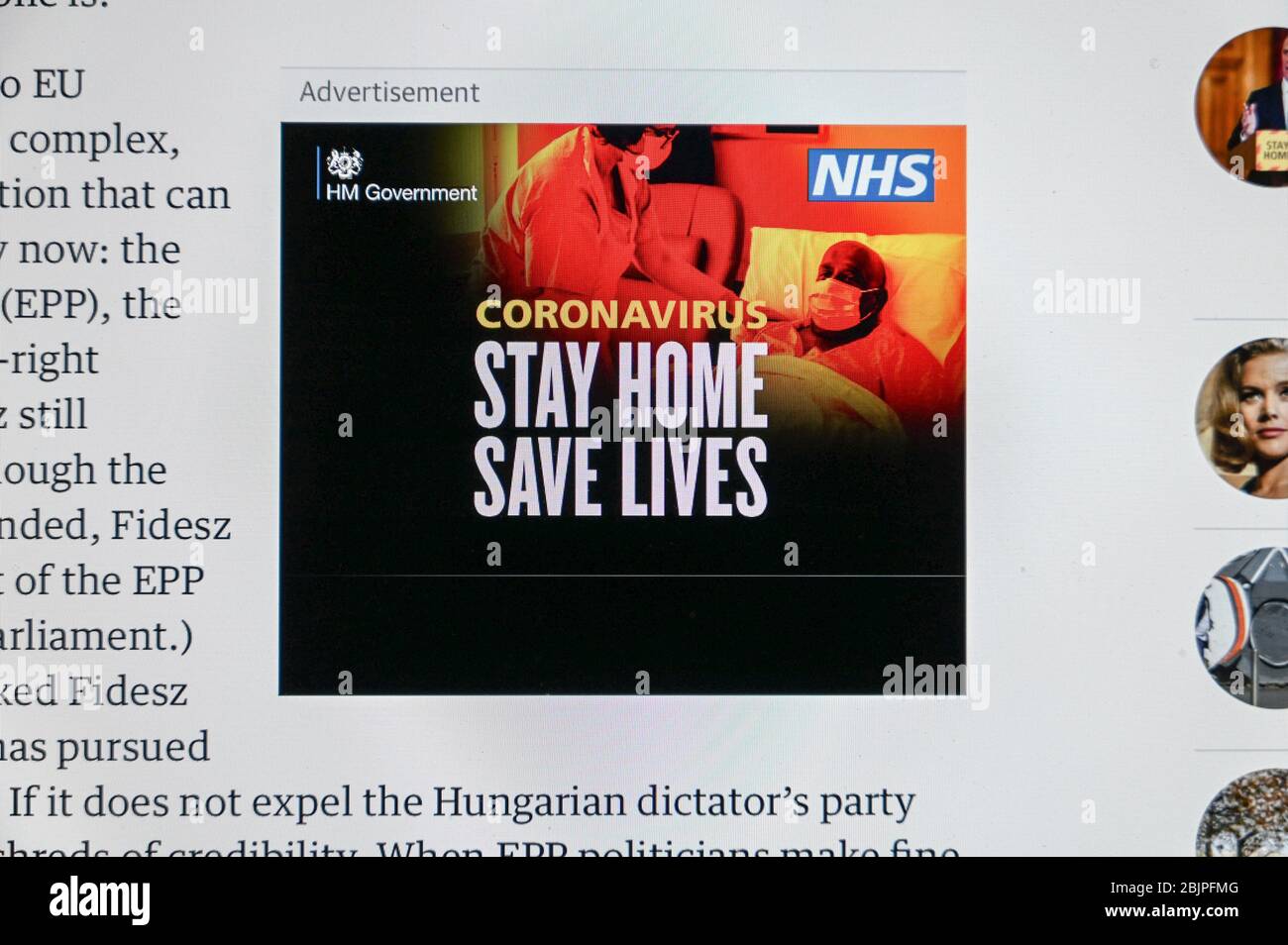 Covid/ Coronavirus. UK government public health advert 'Stay home Save Lives' over a picture of a nurse and patient in masks. Stock Photo