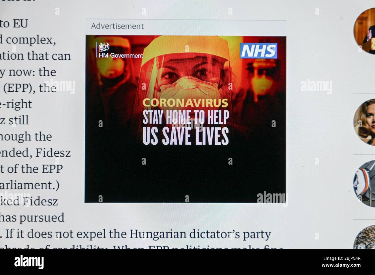 Covid/ Coronavirus. UK government public health advert 'Stay home help us save lives', over a picture of a health worker. Stock Photo