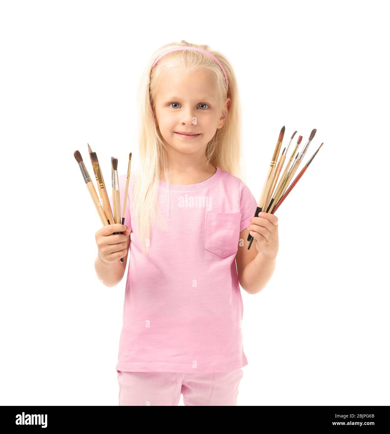 Cute little girl with brushes for painting on white background Stock ...