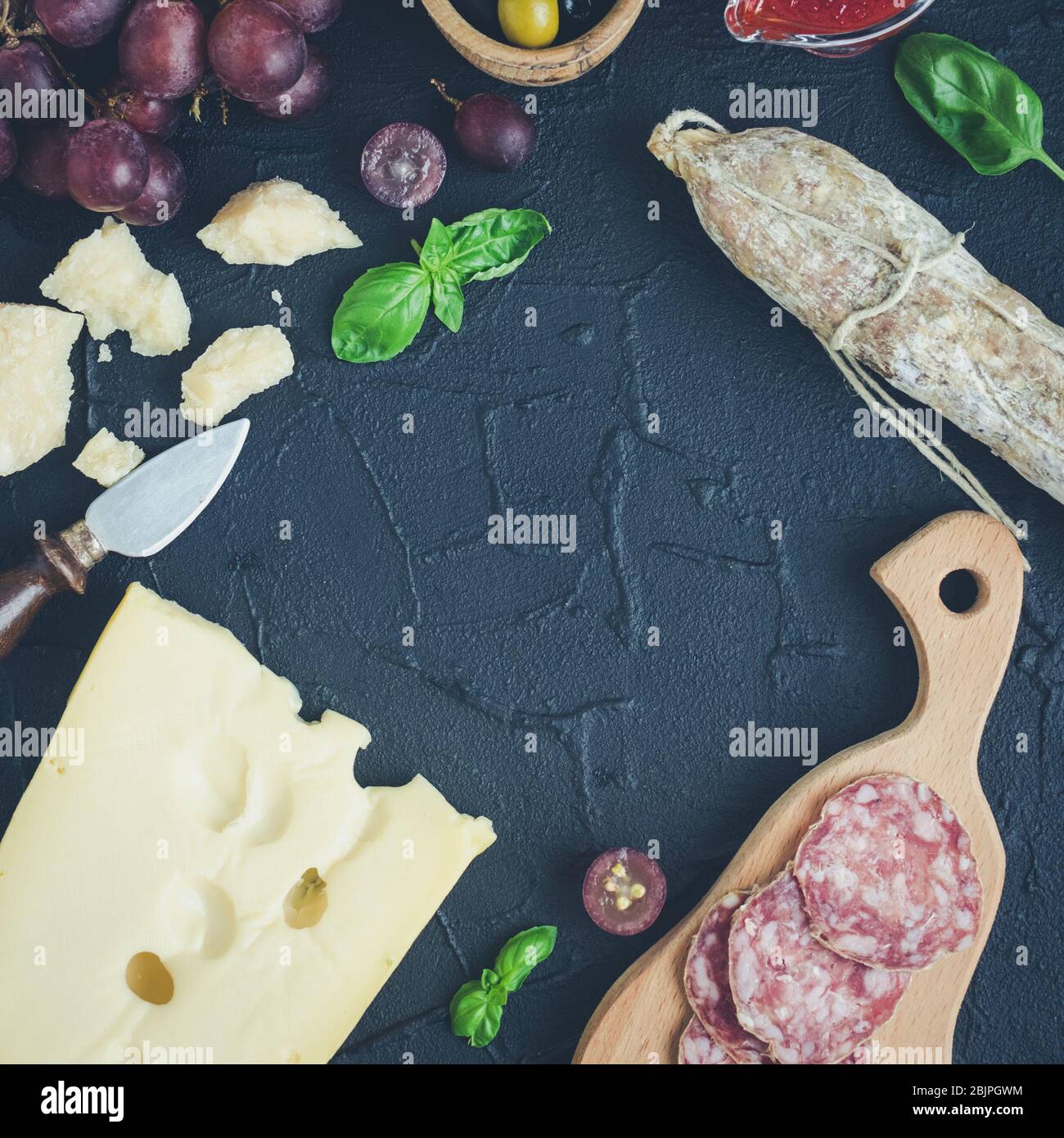 Table full of mediterranean appetizers, tapas or antipasti. Assorted ...