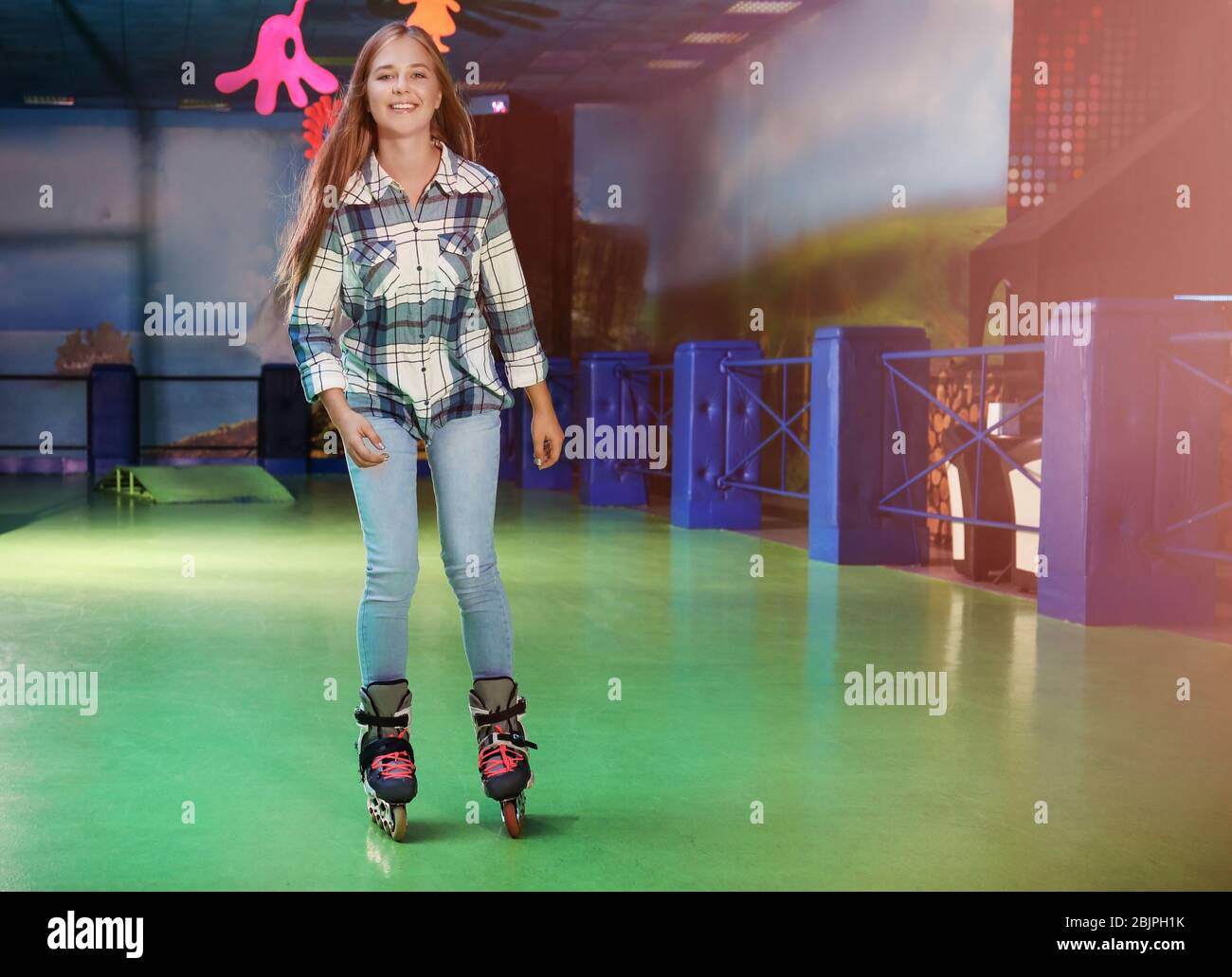 Charming teenage girl at roller skating rink Stock Photo Alamy