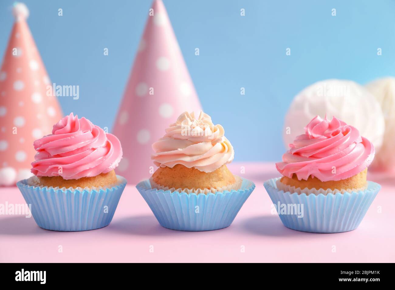 Yummy cupcakes on table Stock Photo