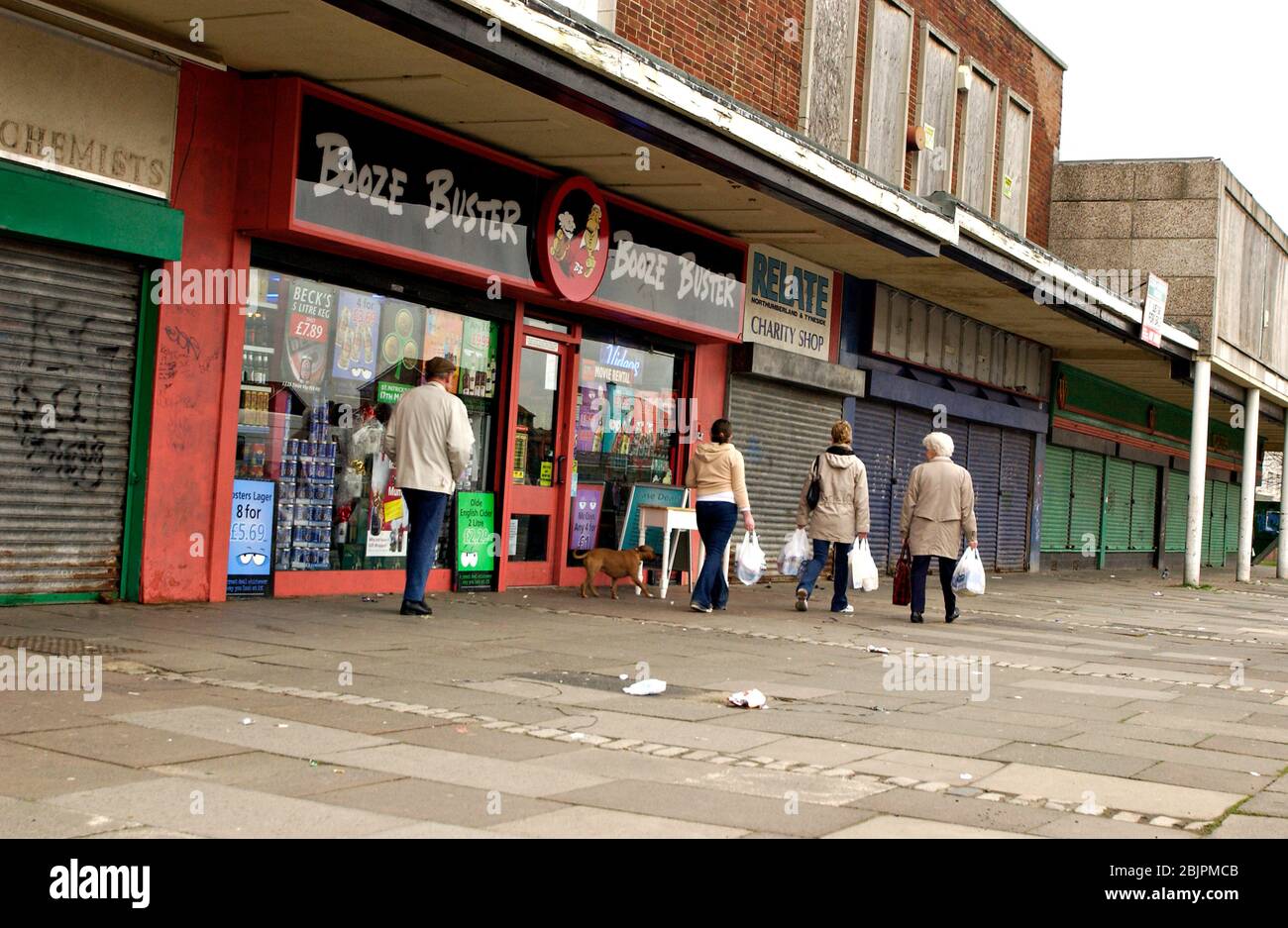 Boarded up closed shops in council estate shopping arcade; Newcastle