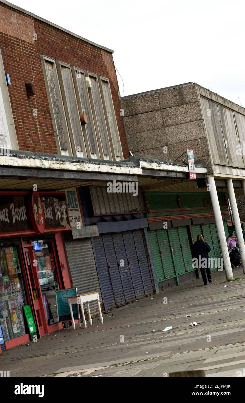 Boarded up closed shops in council estate shopping arcade; Newcastle upon Tyne UK Stock Photo