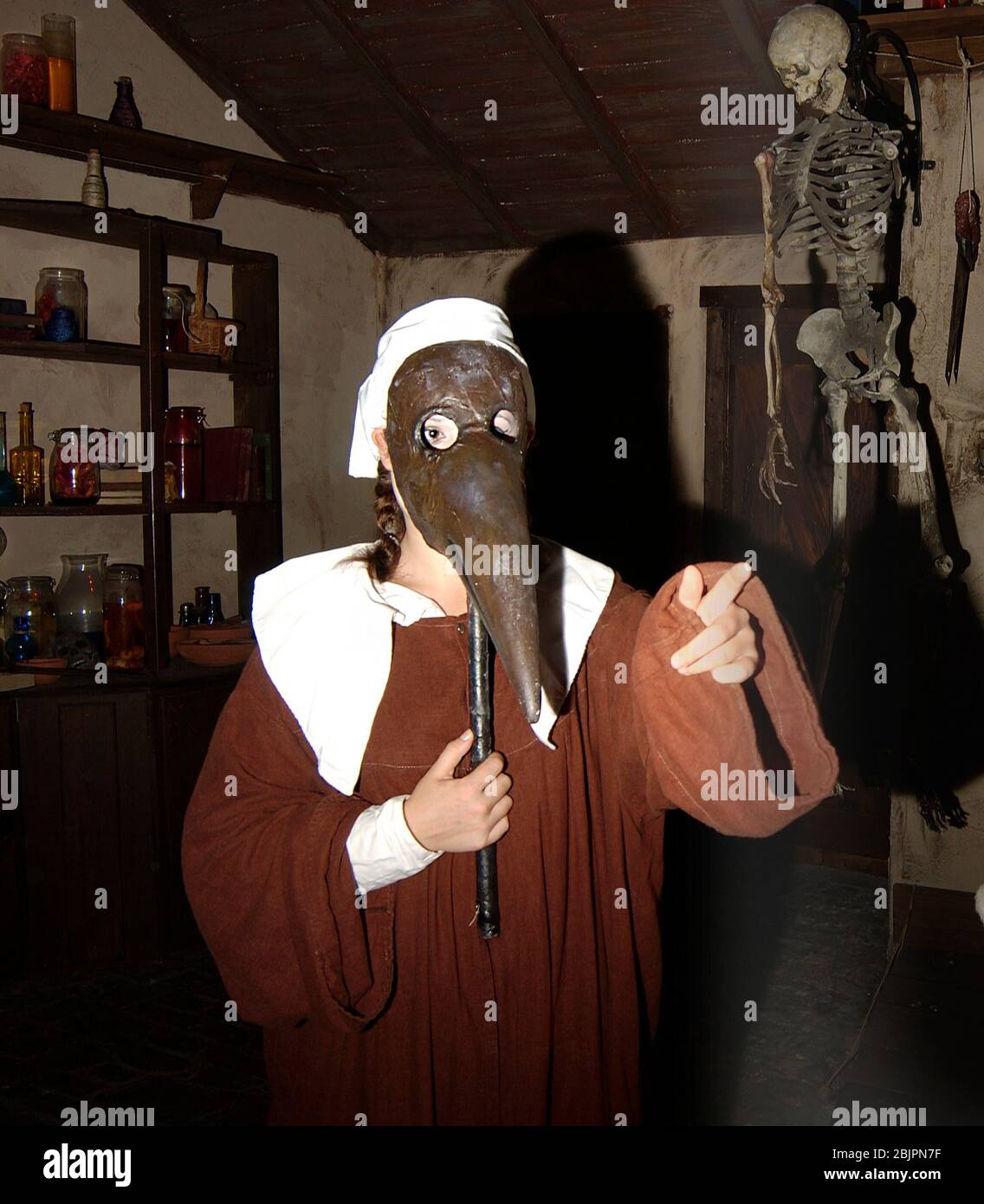 Plague Doctor in  beak-like mask at The London Dungeon an uniquely thrilling Haunted house attraction of  the capital's most perilous past.- Stock Photo