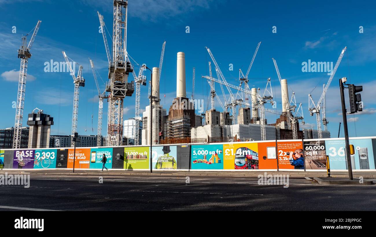 Battersea Power Station, London. Hoarding illustrating the benefits of gentrification following local residential and business redevelopment. Stock Photo