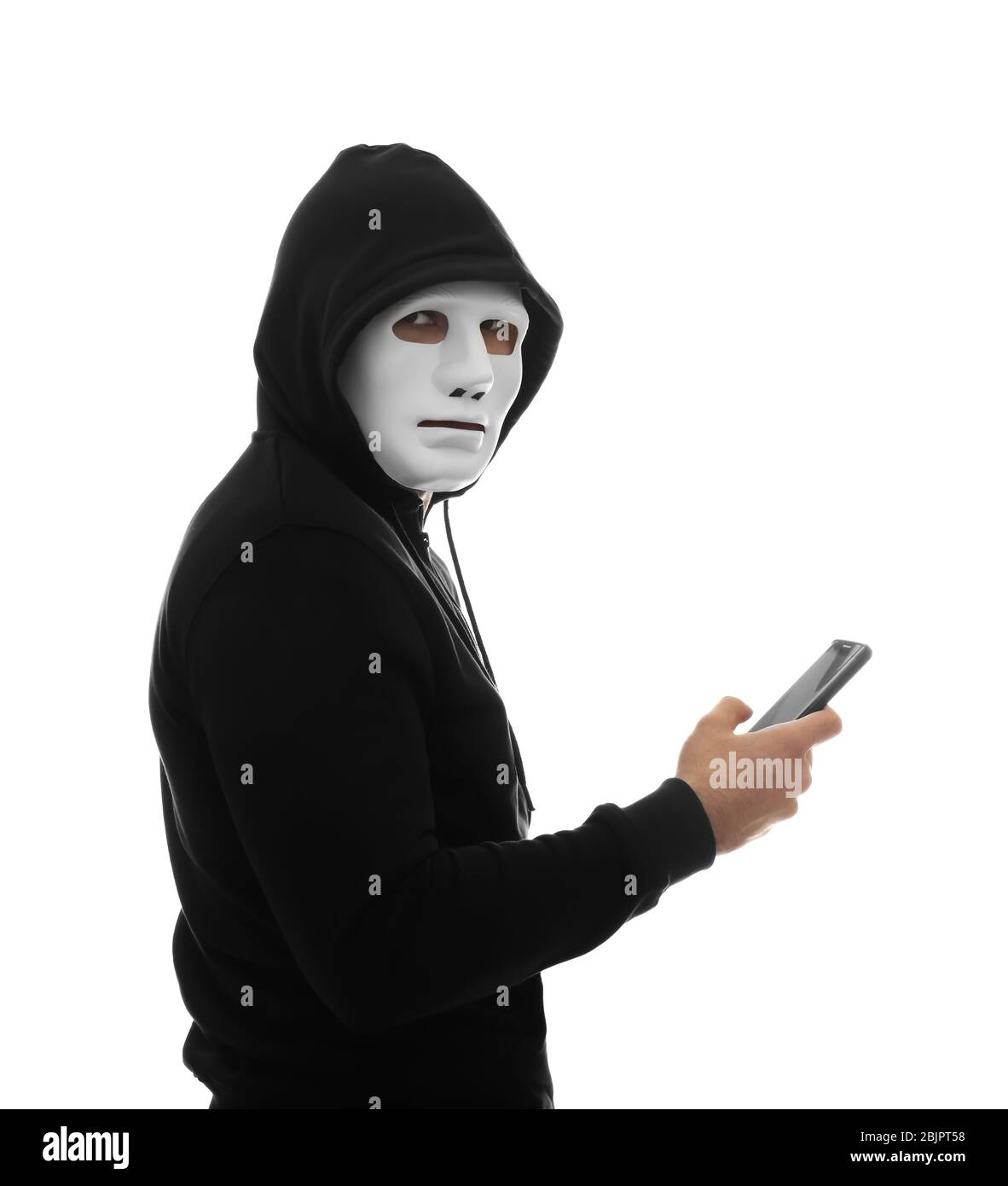 Hacker with phone on white background Stock Photo