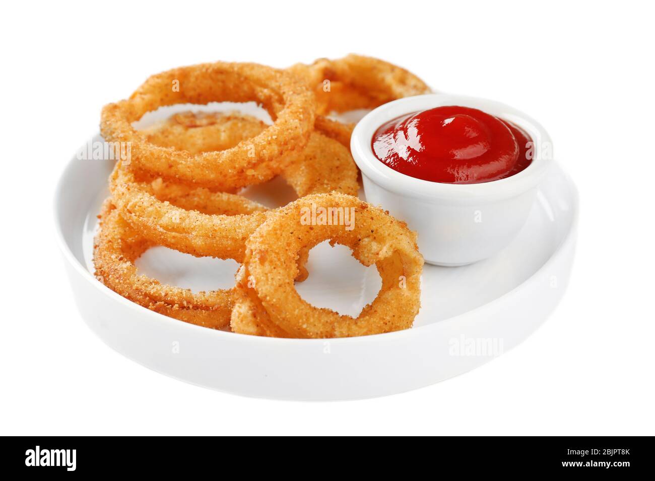Plate with fried breaded onion rings and ketchup on white background