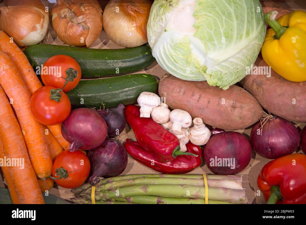 Box of various fresh vegetables as delivered by greengrocer in London Stock Photo