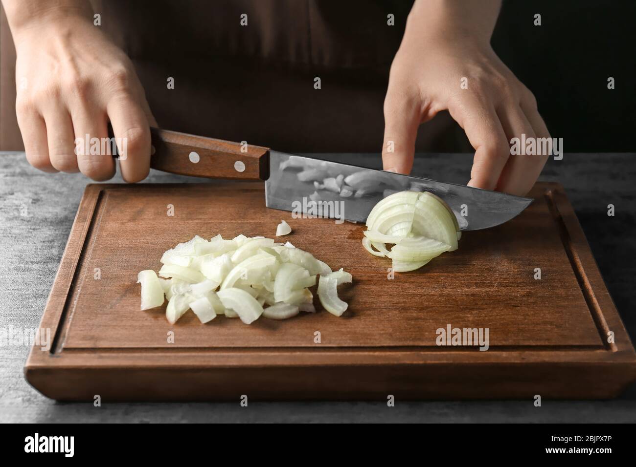 Woman chef cutting chopping onion hi-res stock photography and images ...