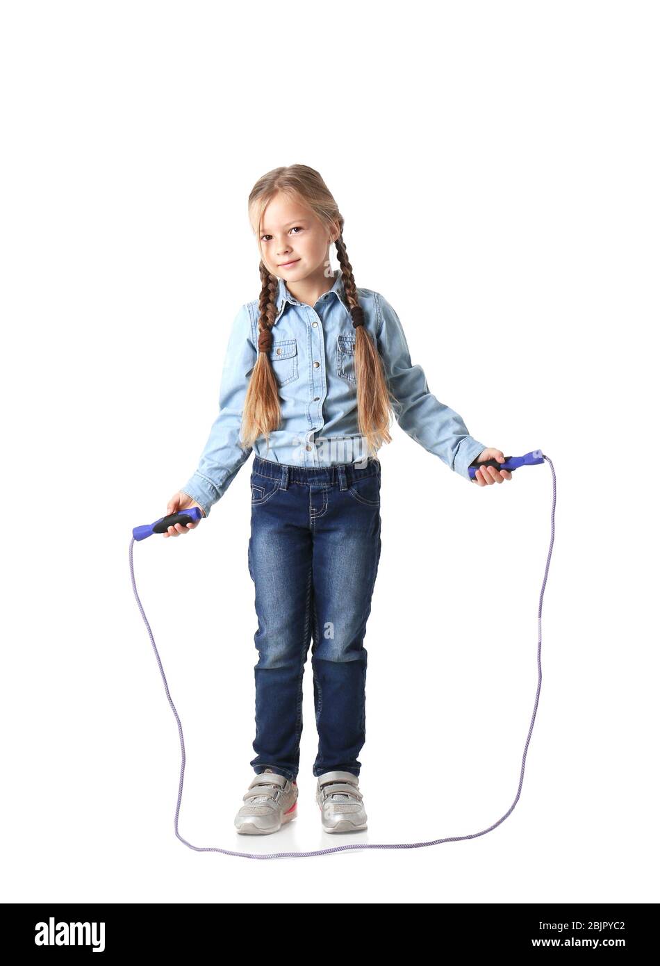 Cute little girl playing with jumping rope on white background Stock ...