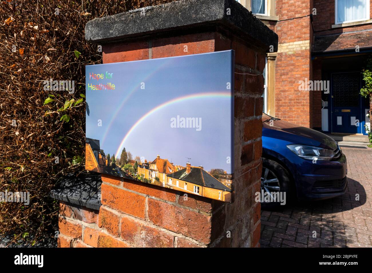 A large photograph of a double rainbow over Heathville Road Gloucester displayed to give hope to the local community during the Covid 19 lockdown. Stock Photo