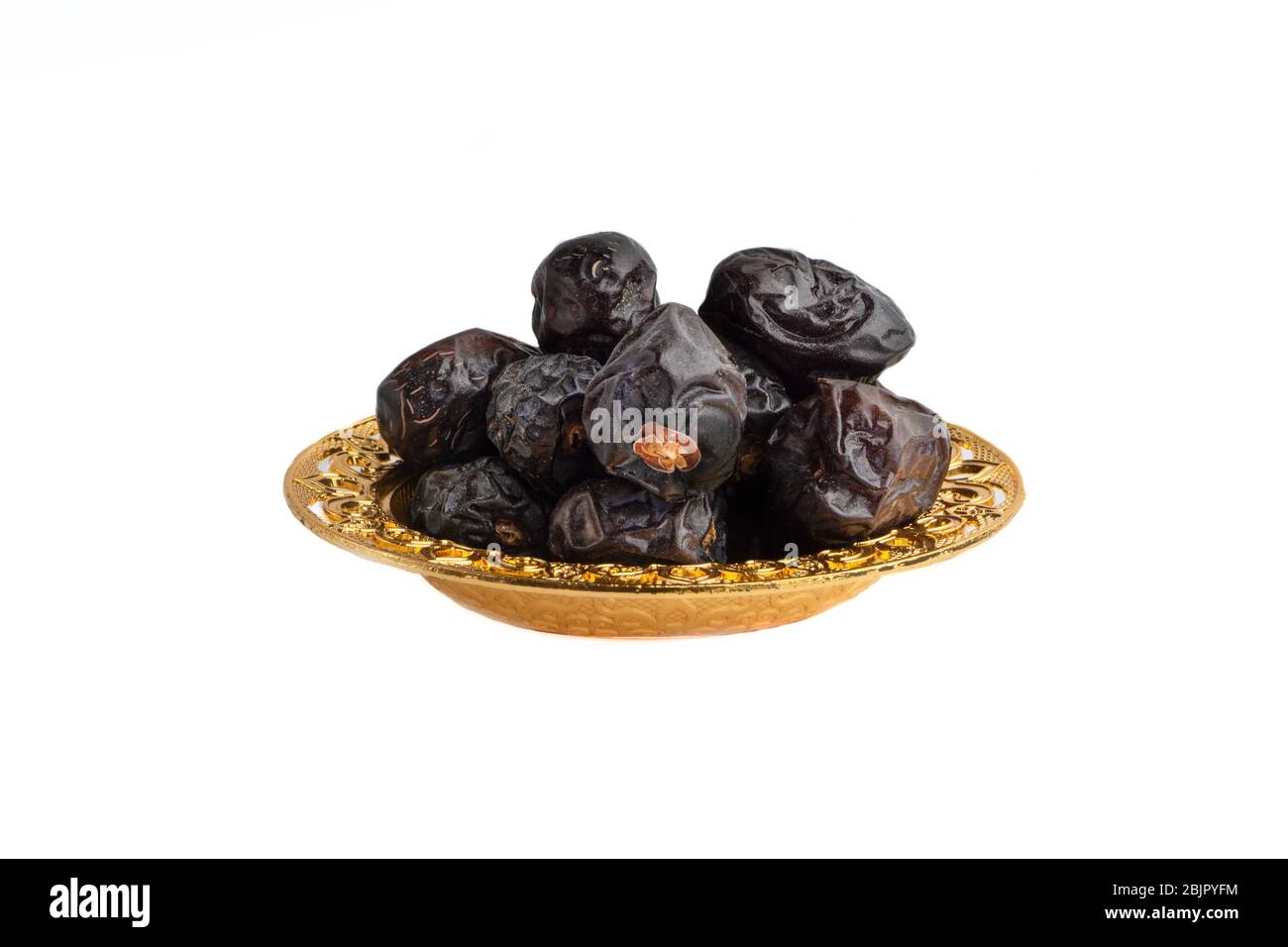 Ajwa Dates fruits or dry dates isolated on white background.Ramadan Kareem  Breaking the fast by eating Tamar Dates Stock Photo - Alamy