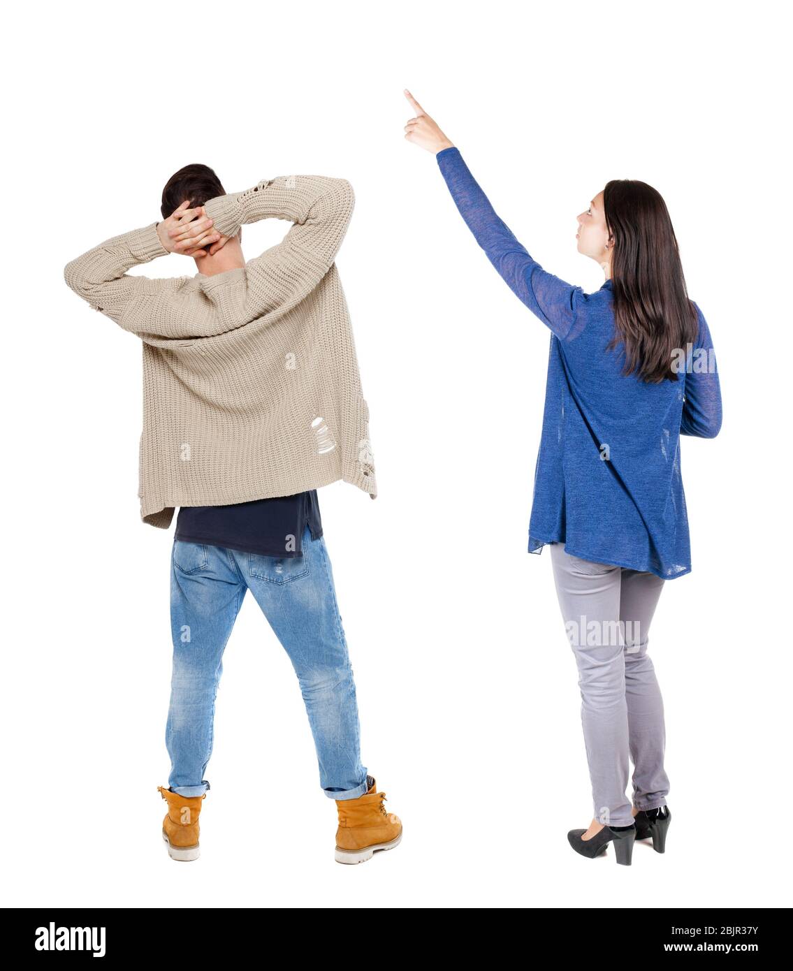Back view of couple in sweater pointing. Rear view people collection ...