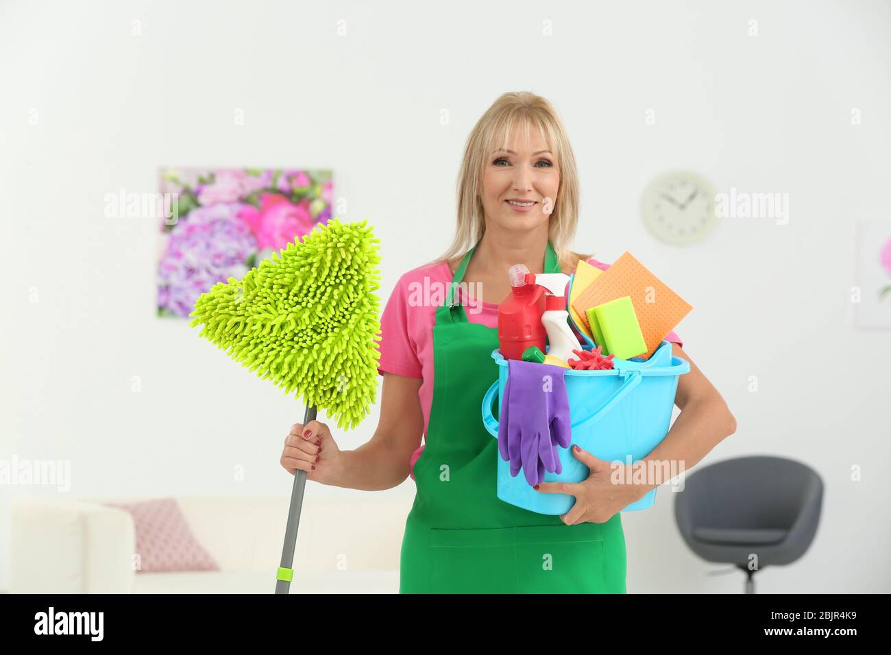 Mature woman cleaning supplies hi-res stock photography and images - Alamy