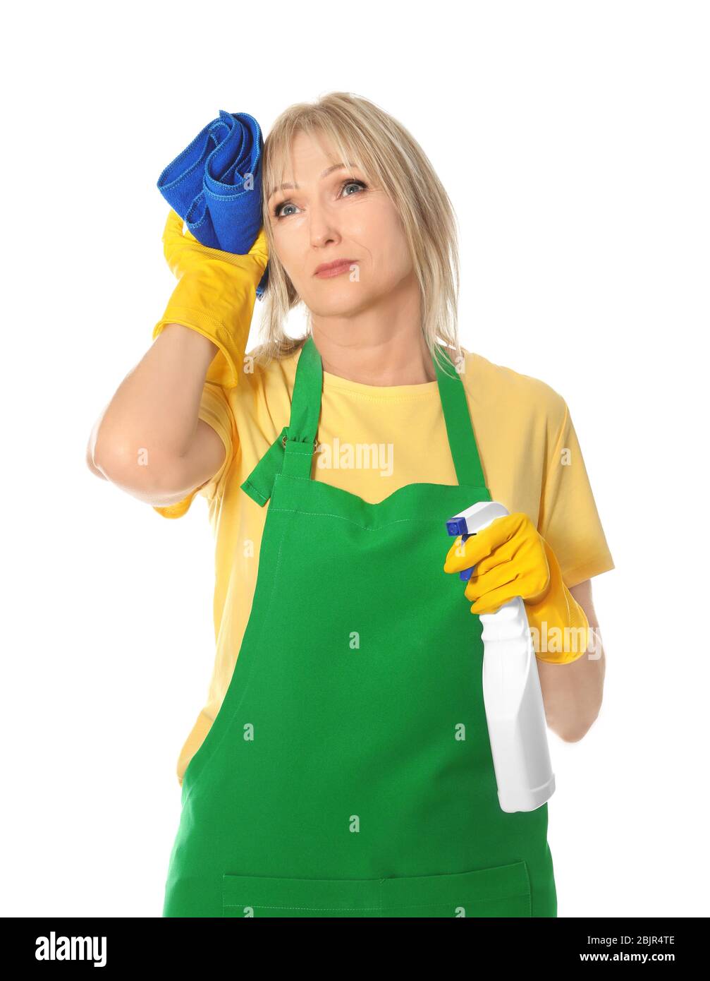 Tired mature woman with bottle of detergent and rag on white background ...
