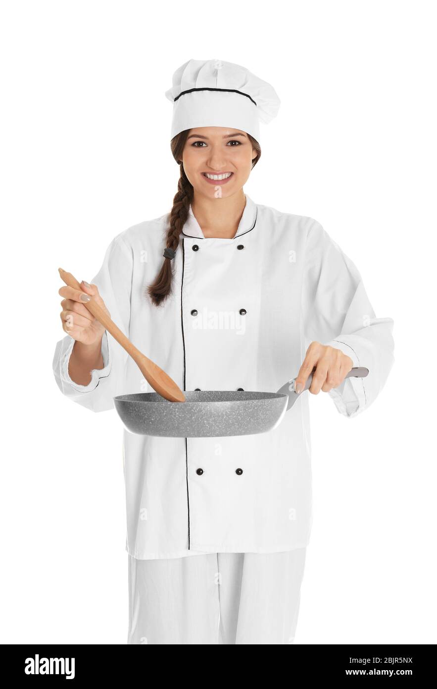 Young female chef with frying pan and spatula, isolated on white Stock Photo