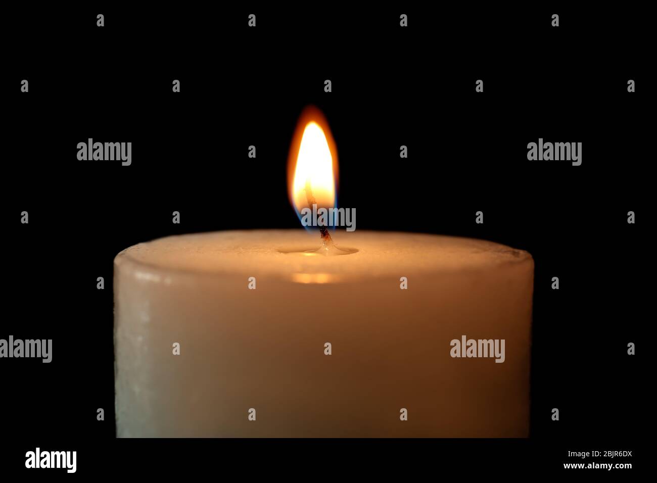 Burning candle on black background, closeup Stock Photo