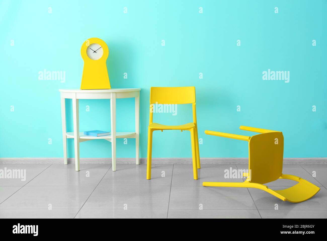 Yellow chairs in room with bright color wall Stock Photo Alamy