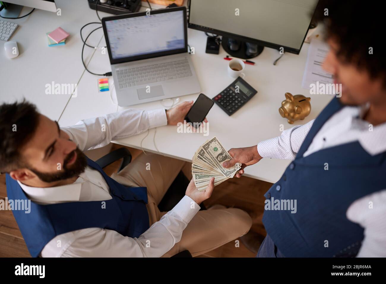 A business deal in the making, investing money, businesspeople concept Stock Photo