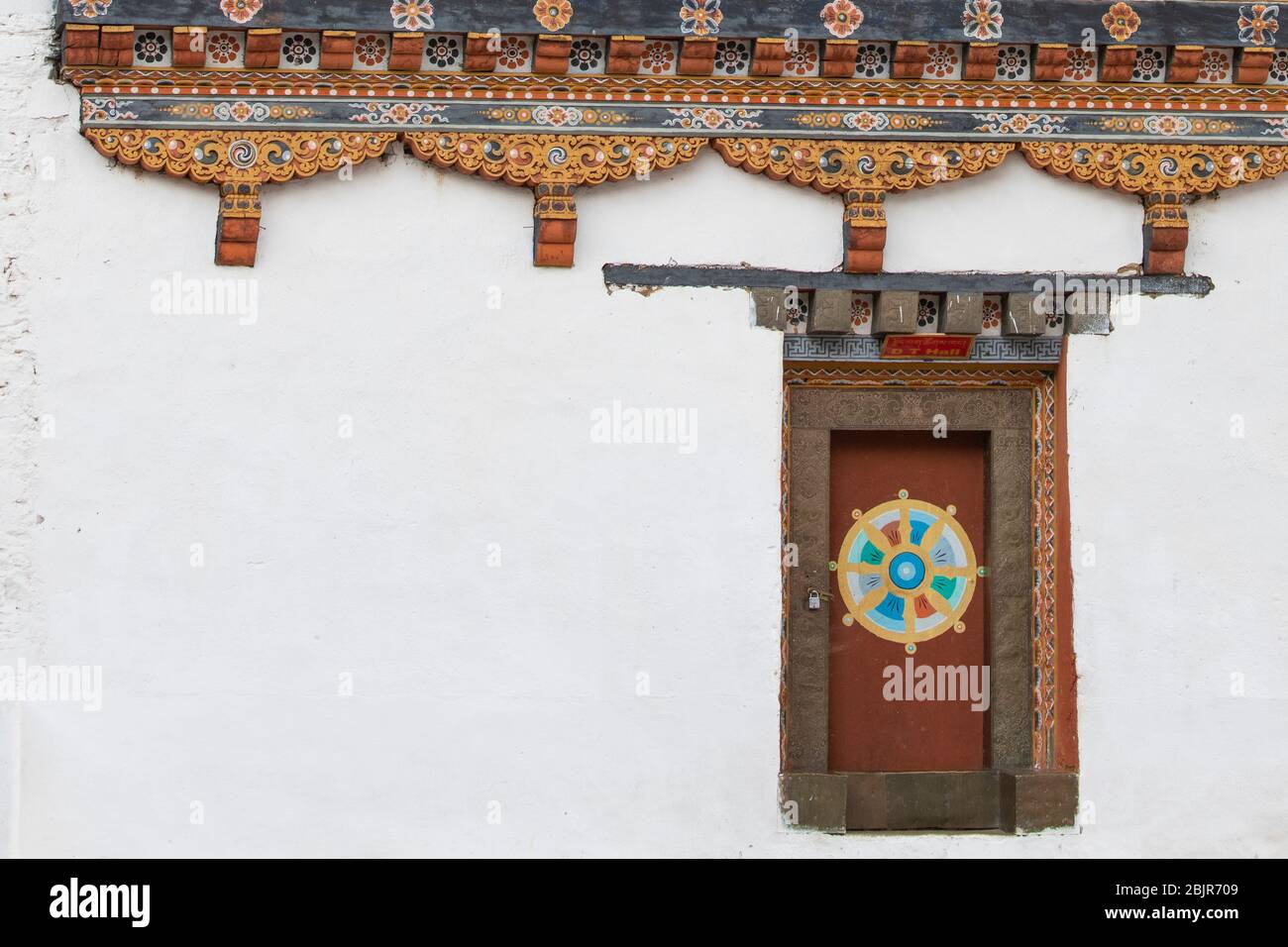Paro, Bhutan. Rinpung Dzong, Buddhist monastery and fortress. Detail of traditional ornate Bhutanese hand carved wooden architecture. Stock Photo