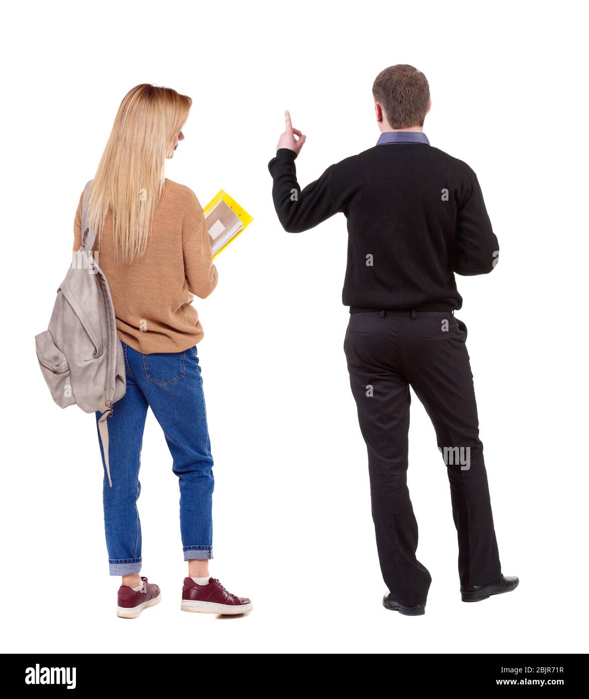 Back view of couple in sweater pointing. Rear view people collection ...