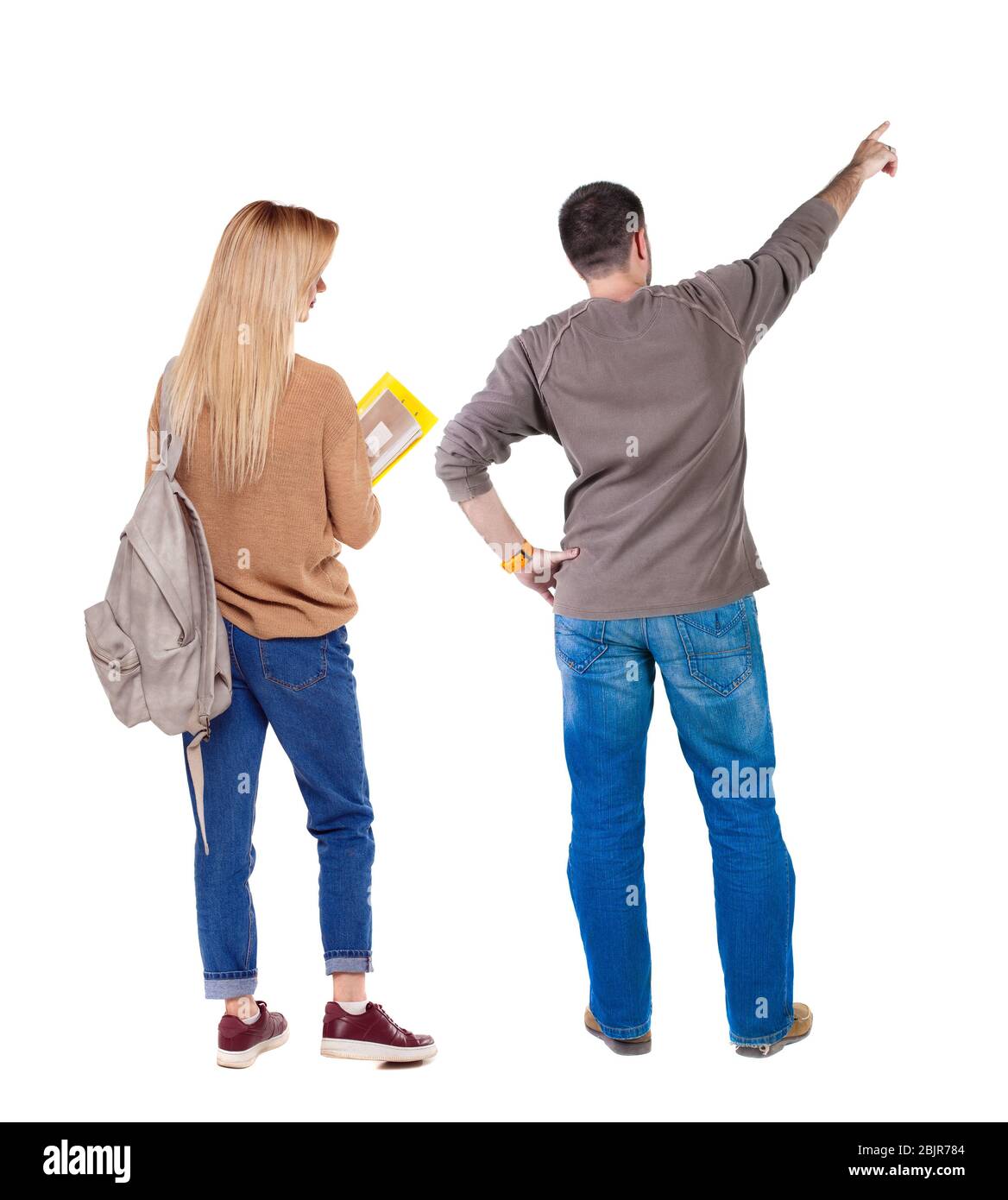 Back view of couple in sweater pointing. Rear view people collection ...