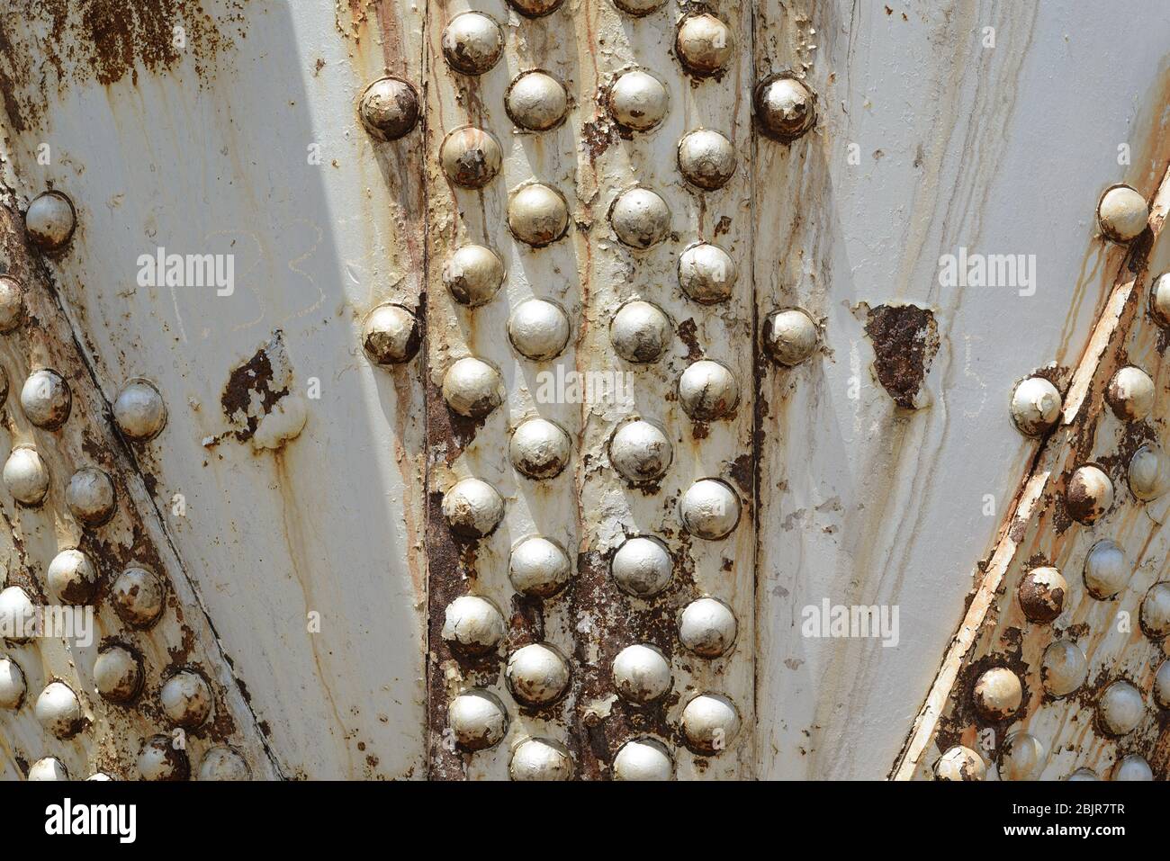 Close-up of an old, riveted, industrial storage tank Stock Photo