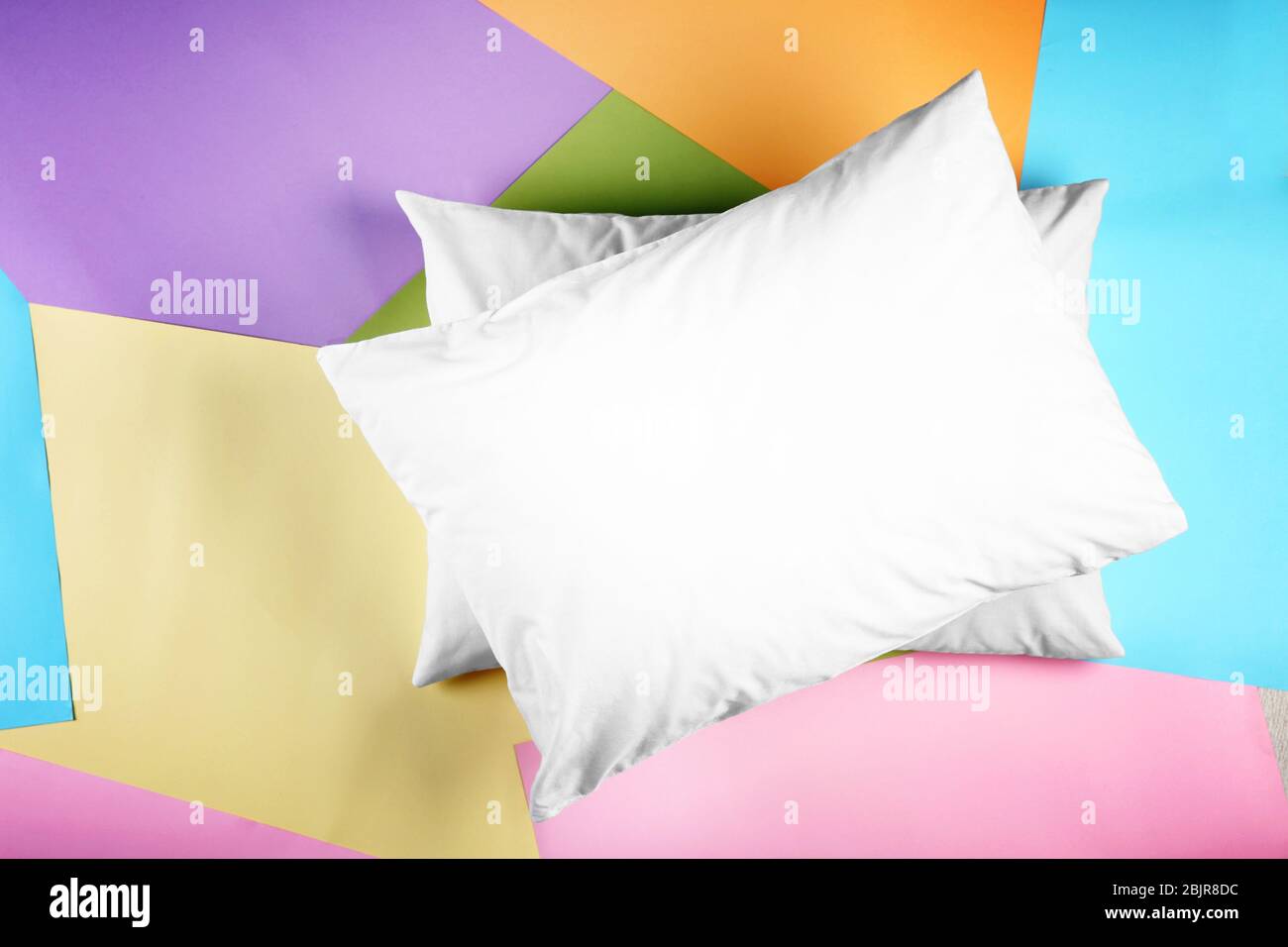 Blank soft pillows on color background Stock Photo