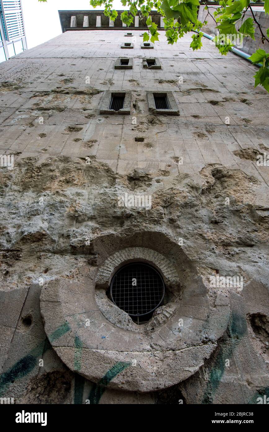 Bullet holes and shell holes on the facade of the Reichsbahnbunker air raid shelter in central Berlin Stock Photo