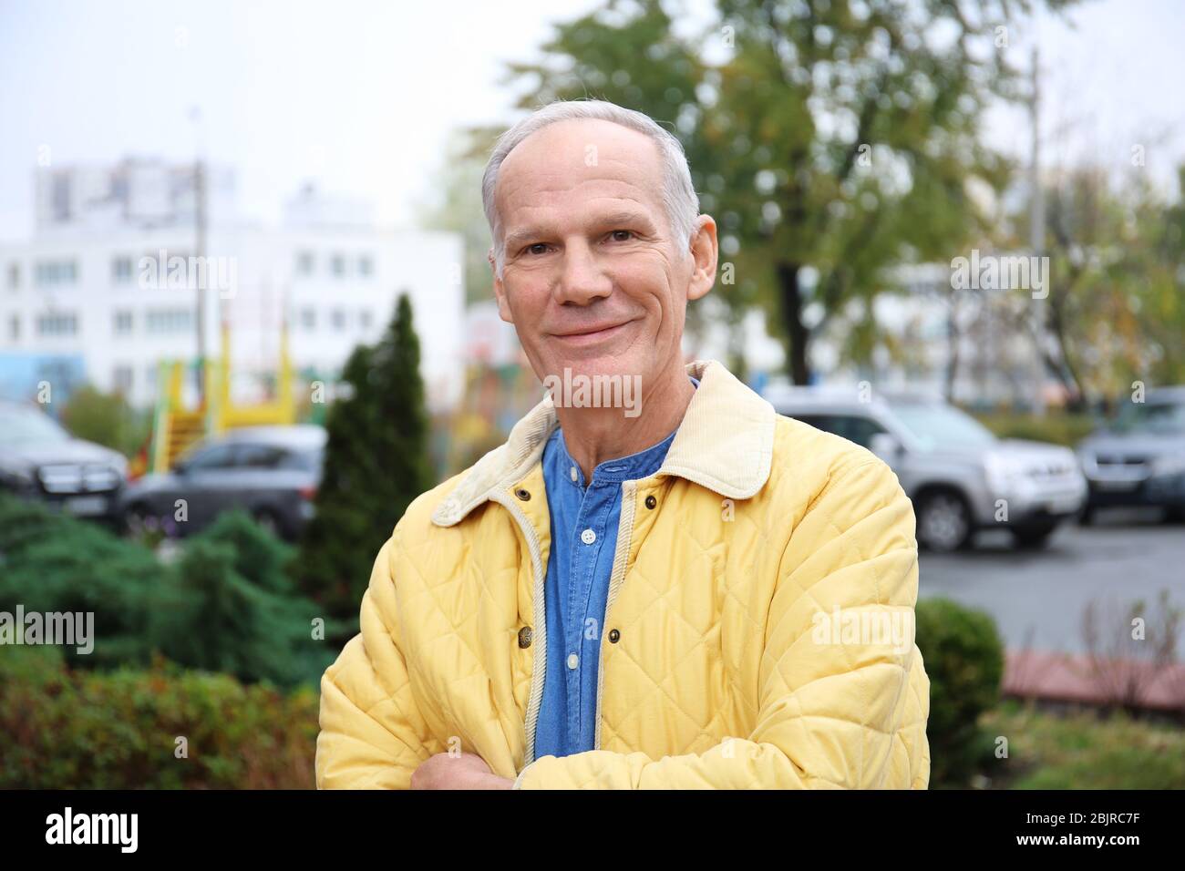 Charismatic senior man outdoors Stock Photo