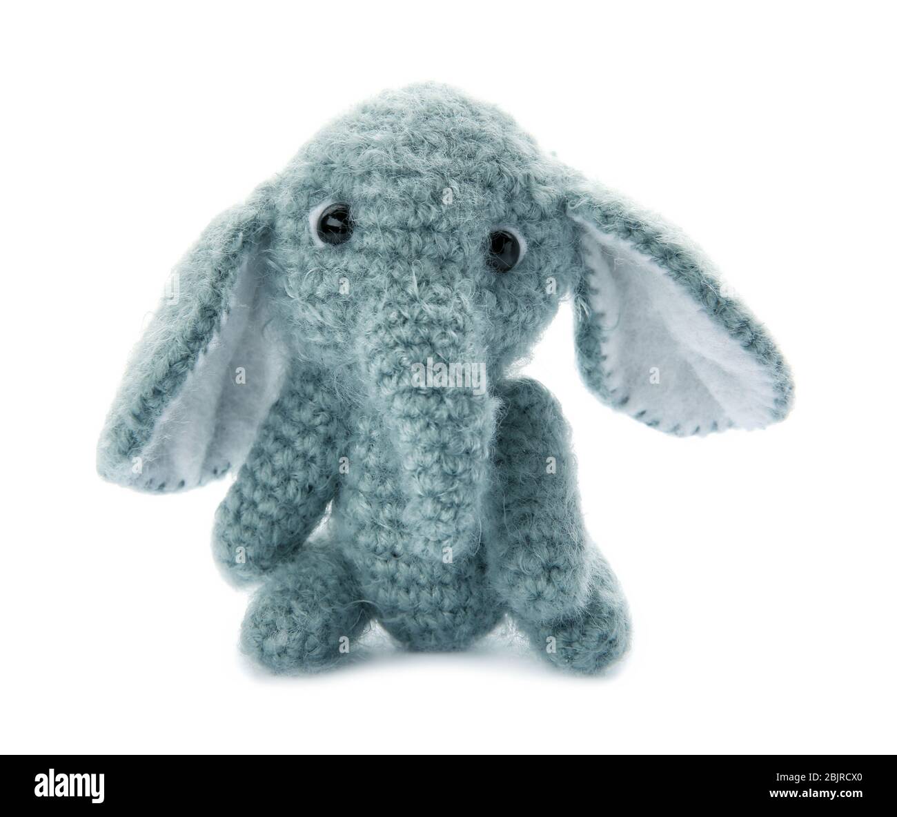 Cute knitted toy elephant on white background Stock Photo