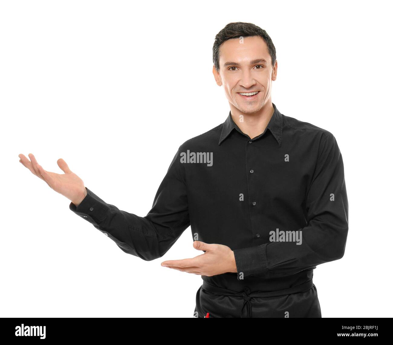 Waiter in black uniform on white background Stock Photo - Alamy