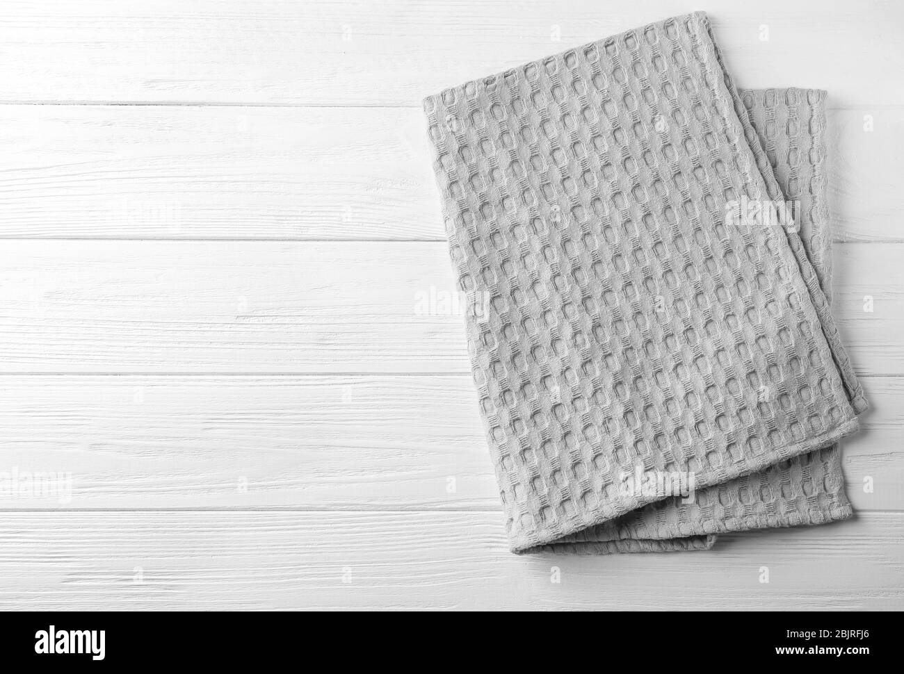 Clean kitchen towel on white wooden table, top view Stock Photo