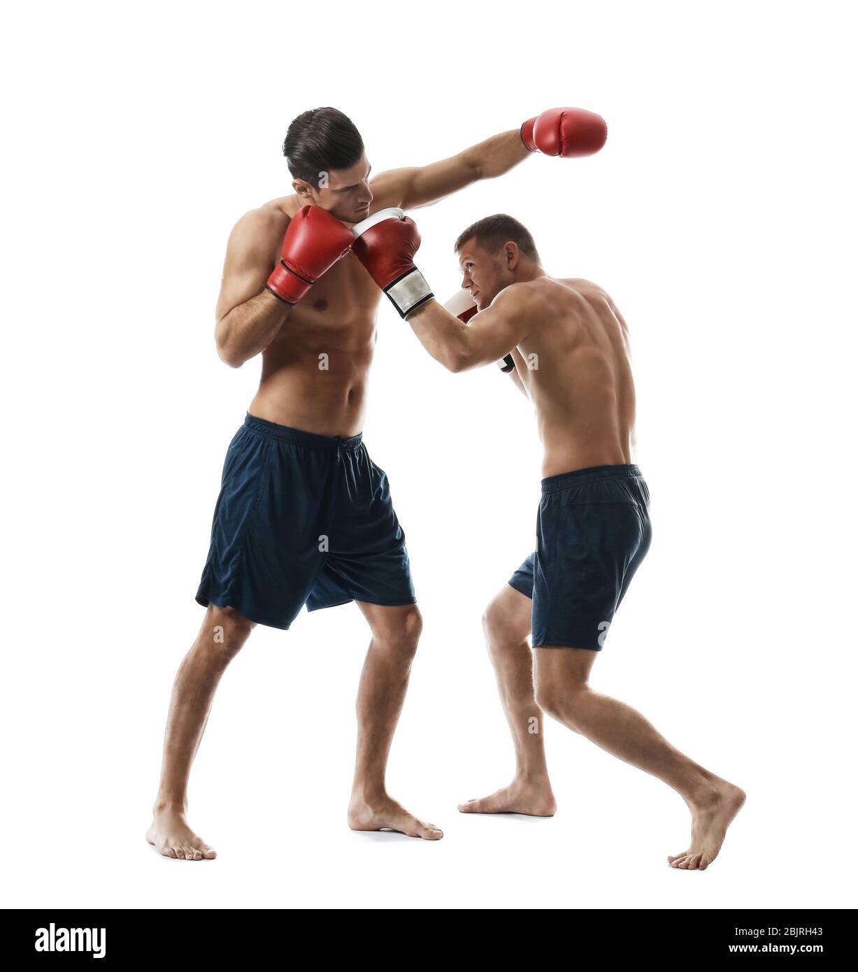 Attractive young boxers fighting on white background Stock Photo