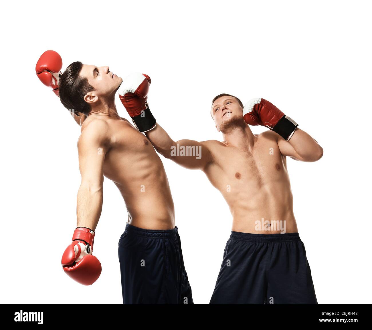 Attractive young boxers fighting on white background Stock Photo - Alamy