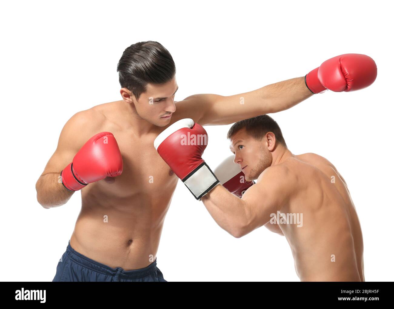 Attractive young boxers fighting on white background Stock Photo