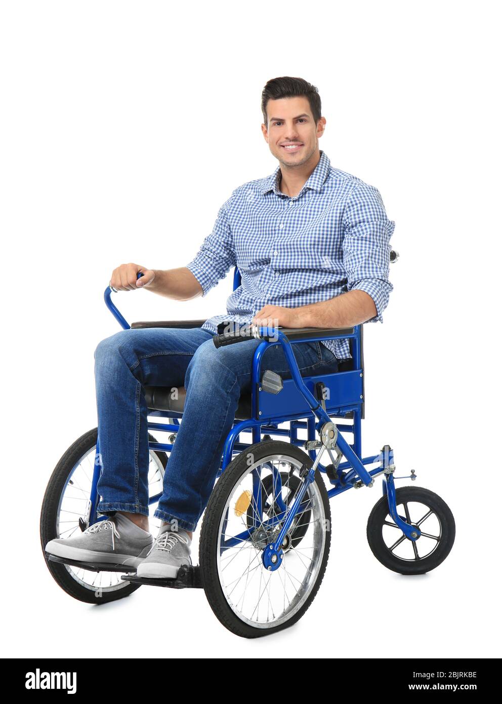 Attractive young man in wheelchair on white background Stock Photo