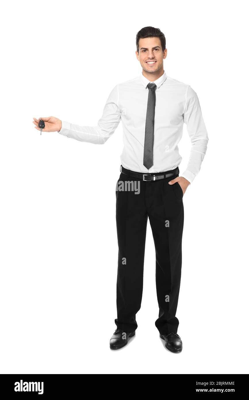 Salesman in formal clothes holding car key on white background Stock ...