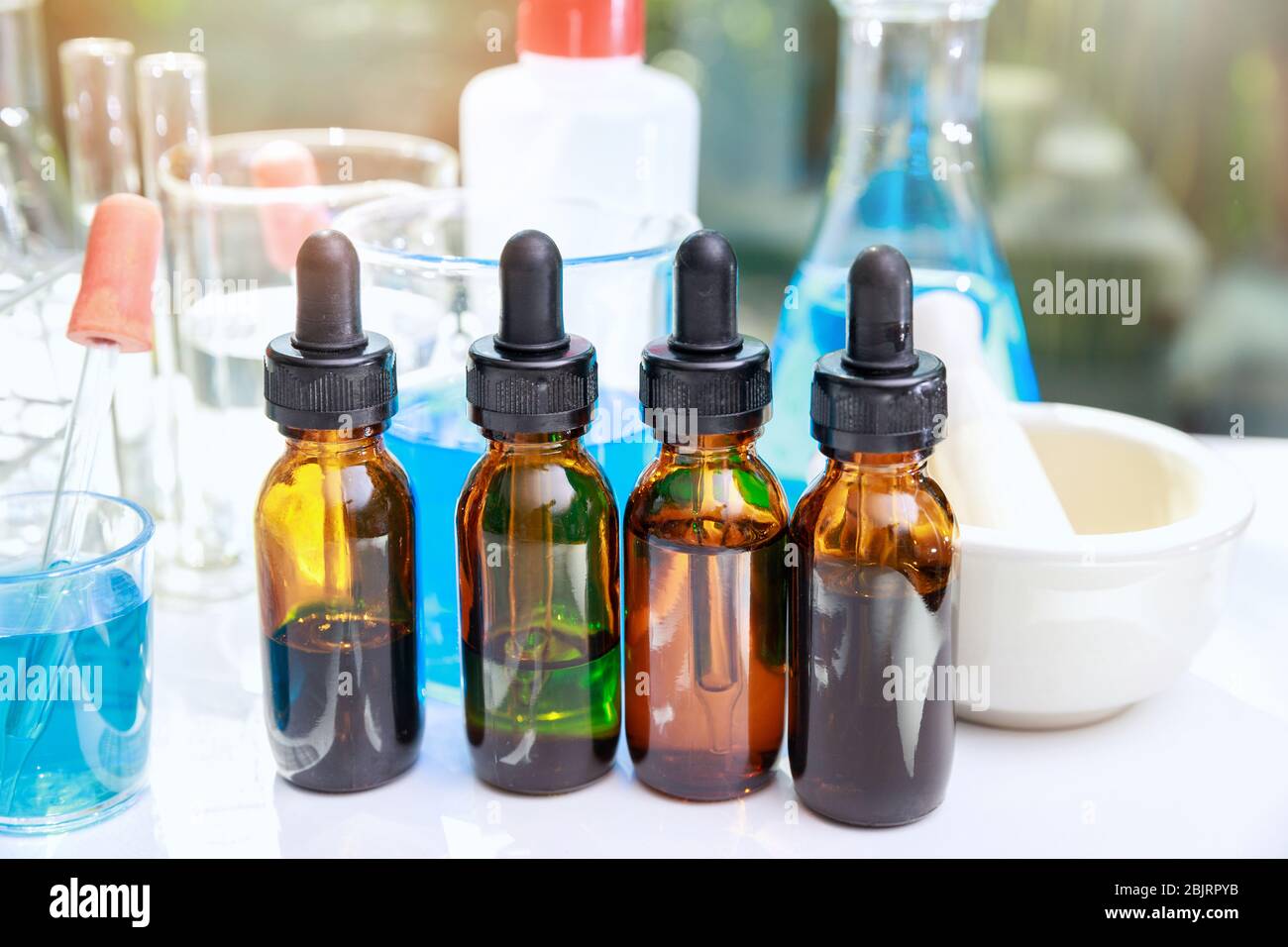 Bottle with beaker and laboratory glassware. Group of laboratory flasks ...