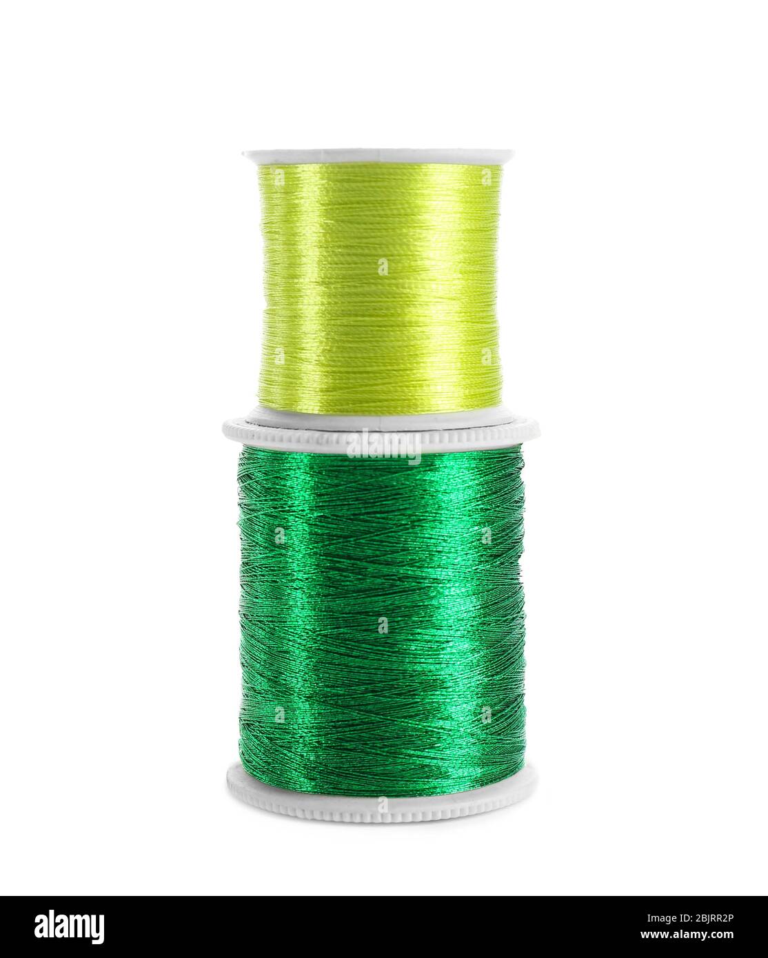 Green sewing threads on white background Stock Photo Alamy