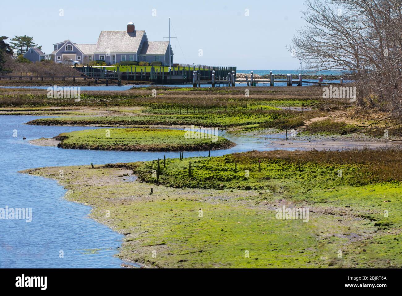 An upscale  ocean front home on Saquatucket Habor in Harwich Port, Mass. on Cape Cod, USA Stock Photo