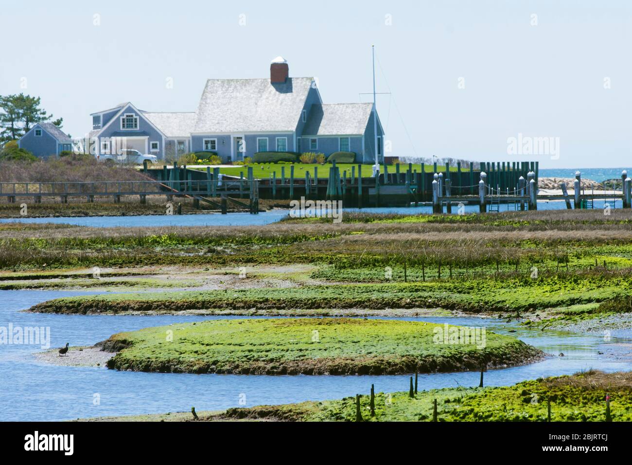 An upscale  ocean front home on Saquatucket Habor in Harwich Port, Mass. on Cape Cod, USA Stock Photo